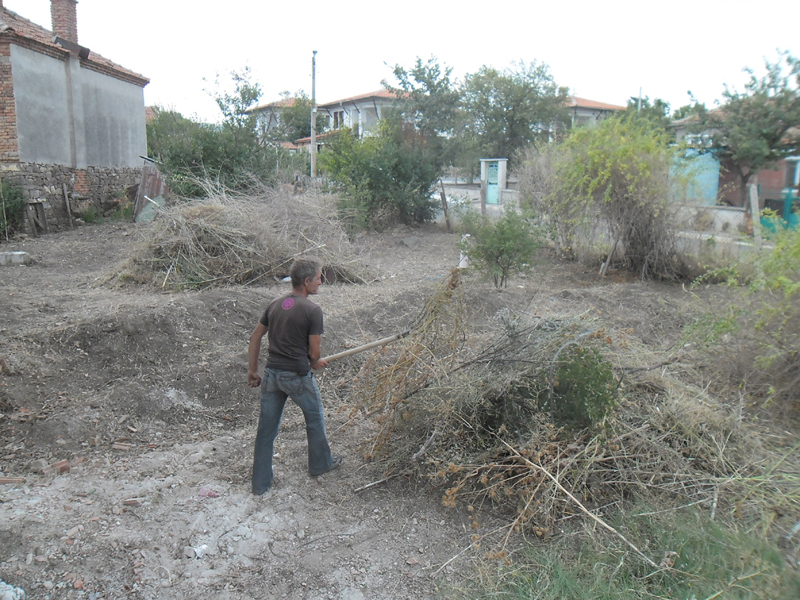 Angel cleaning the front garden