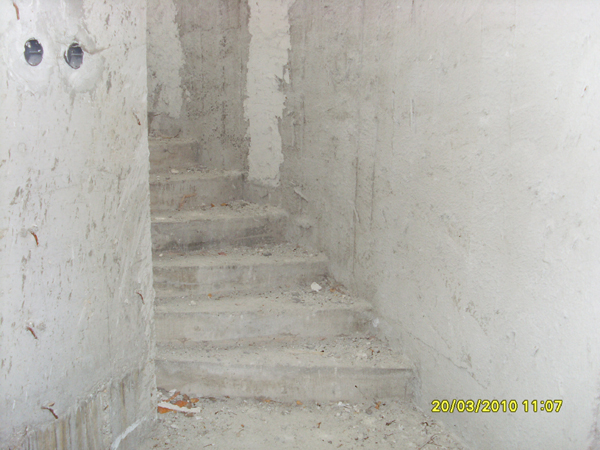 Stairs from basement up to ground floor